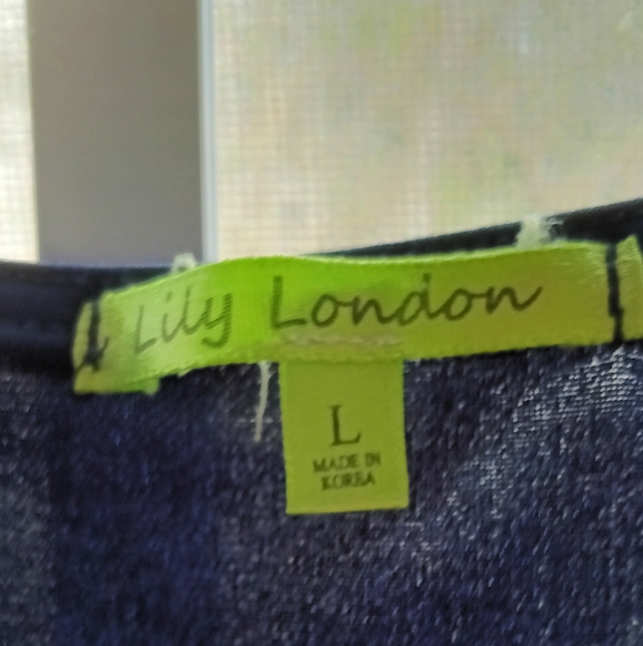 Stunning array of color on this navy shirt remind me of Picasso. - Picture 5 of 6